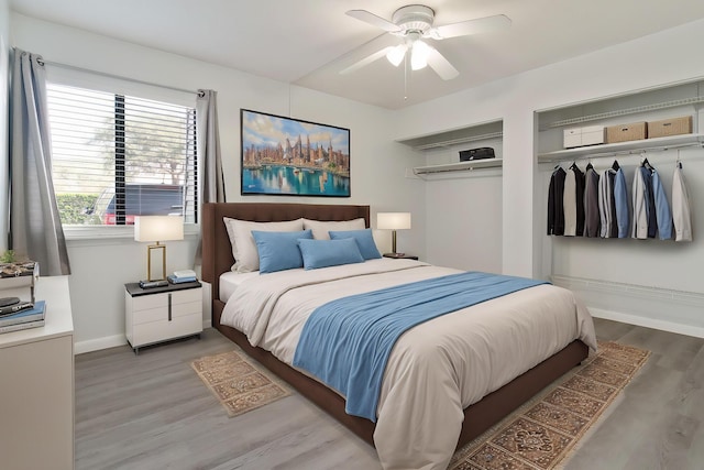 bedroom with hardwood / wood-style flooring and ceiling fan