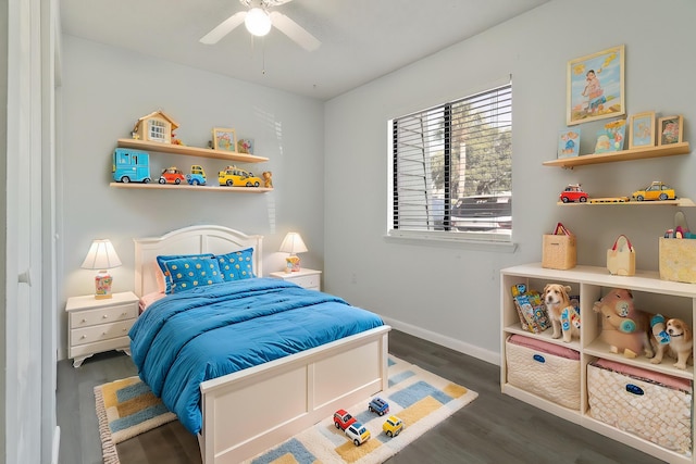 bedroom featuring dark hardwood / wood-style flooring and ceiling fan