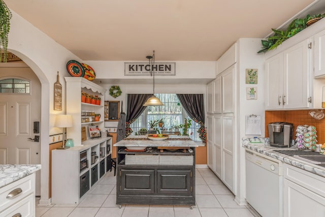 kitchen featuring white cabinetry, backsplash, dishwasher, light tile patterned floors, and light stone countertops