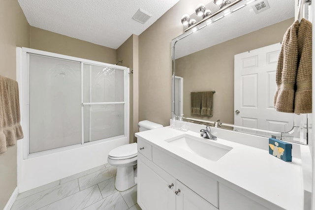 full bathroom with enclosed tub / shower combo, a textured ceiling, vanity, and toilet