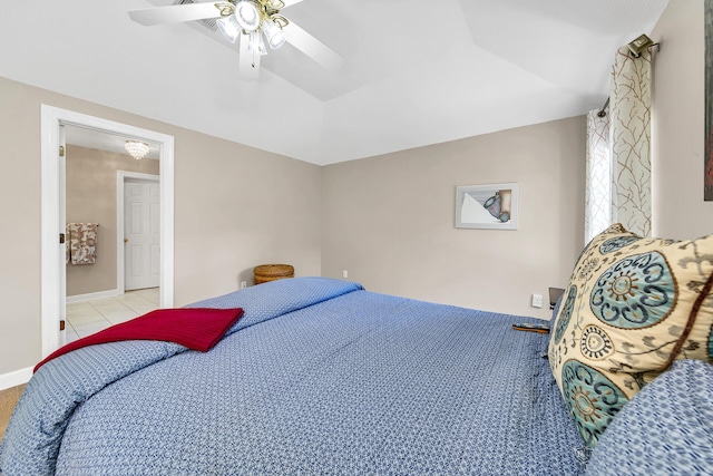 tiled bedroom featuring ceiling fan