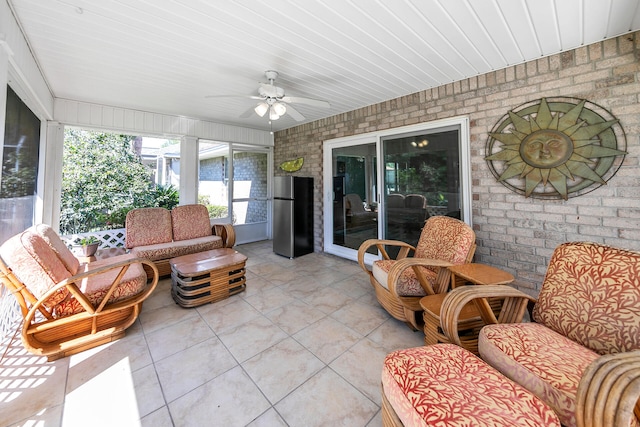 sunroom / solarium with wood ceiling and ceiling fan