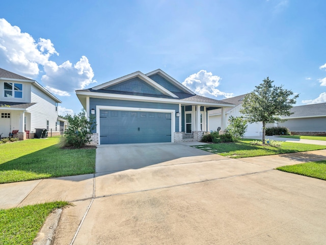 view of front of house with a front yard and a garage