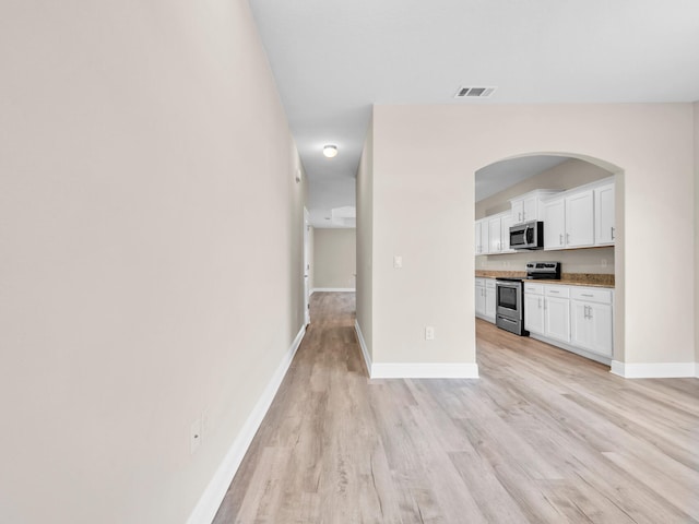 unfurnished living room with light hardwood / wood-style floors