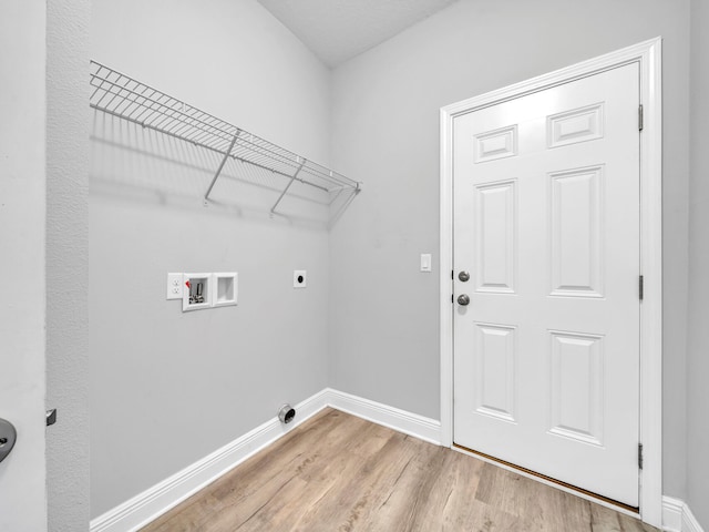 laundry area with washer hookup, light wood-type flooring, and hookup for an electric dryer