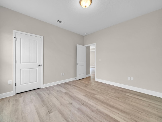 unfurnished bedroom featuring light hardwood / wood-style flooring