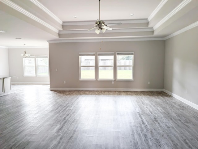 unfurnished room featuring ornamental molding, hardwood / wood-style floors, and plenty of natural light