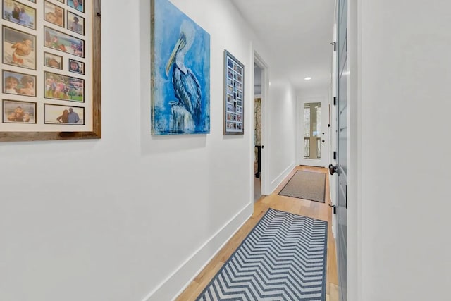 corridor with light wood-type flooring