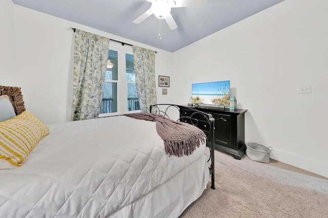 bedroom with ceiling fan and light colored carpet