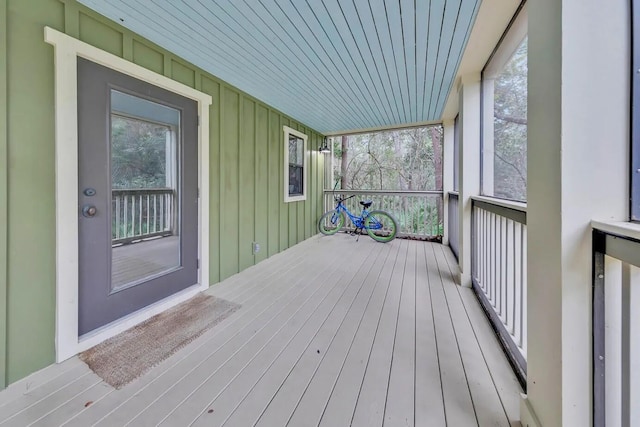 wooden terrace featuring covered porch