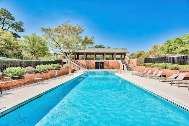 view of swimming pool with a patio area