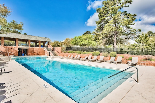 view of swimming pool with a patio area