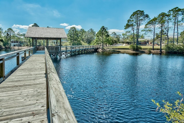 dock area with a gazebo and a water view