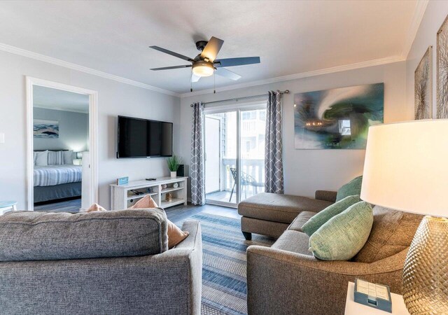 living room with ceiling fan, crown molding, and wood-type flooring