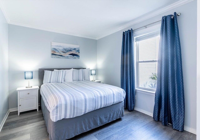 bedroom with crown molding and dark hardwood / wood-style floors