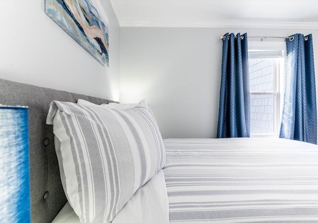 bedroom with ornamental molding