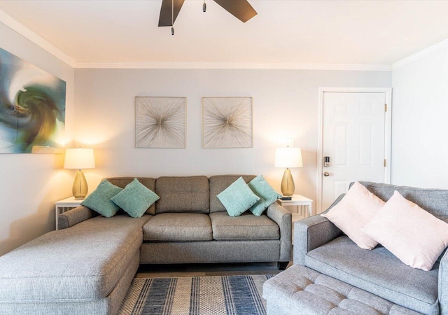 living room with ornamental molding and ceiling fan