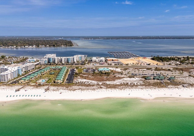 bird's eye view featuring a view of the beach and a water view