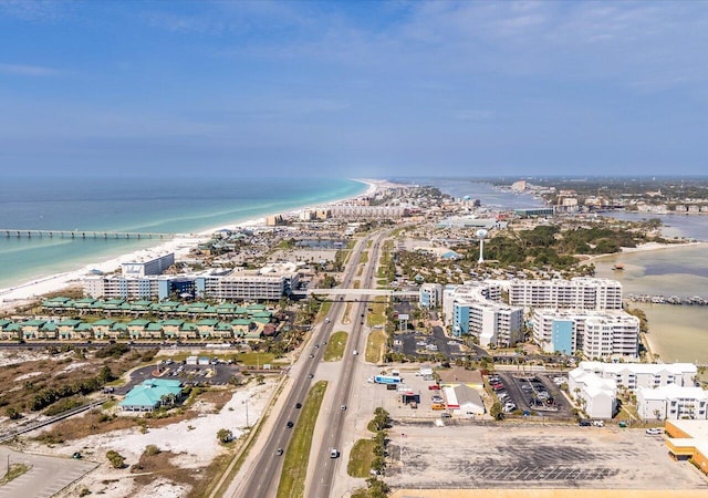 birds eye view of property featuring a view of the beach and a water view