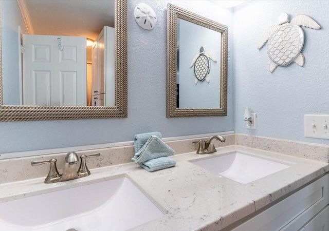 bathroom featuring vanity and crown molding