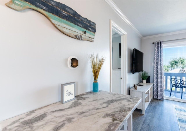 interior space featuring crown molding and dark hardwood / wood-style floors