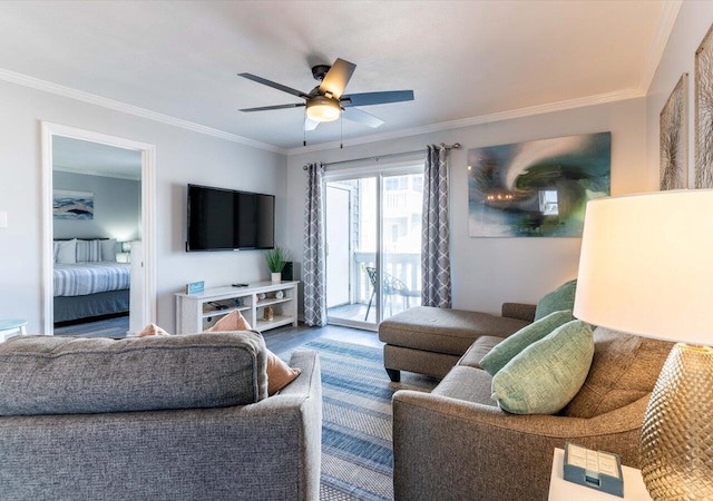 living room with ceiling fan, ornamental molding, and wood-type flooring