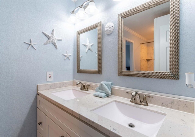 bathroom with vanity and crown molding