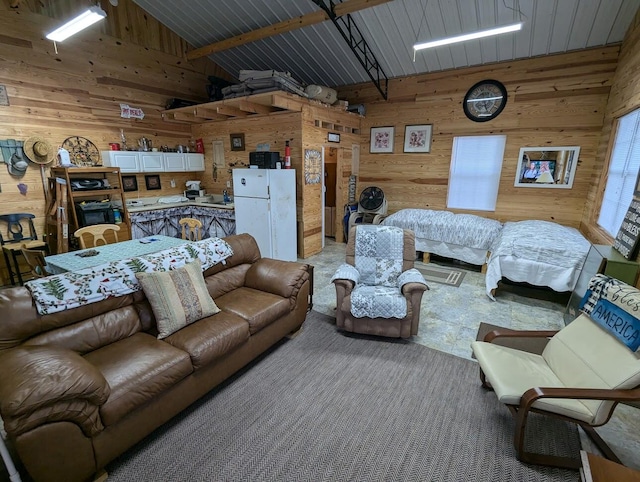 living room featuring beam ceiling, wood ceiling, wooden walls, and high vaulted ceiling