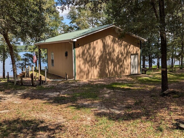 view of outbuilding featuring a water view