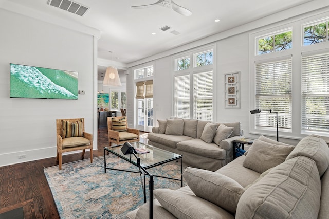 living room with ceiling fan, dark hardwood / wood-style flooring, and french doors