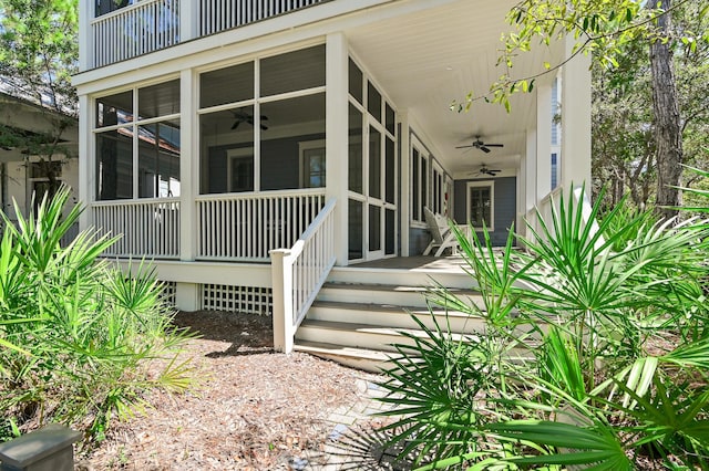 view of exterior entry with ceiling fan