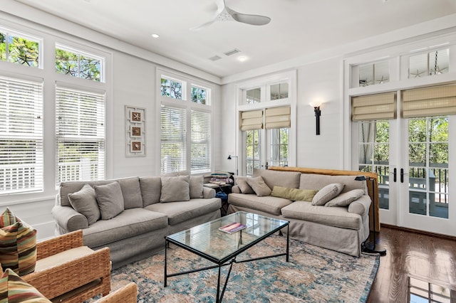 living room featuring hardwood / wood-style flooring and ceiling fan