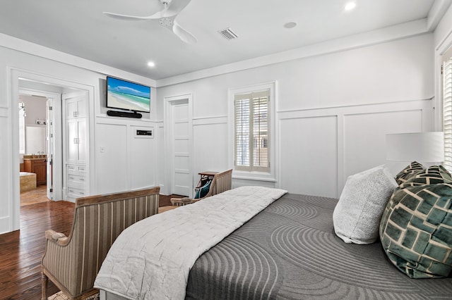 bedroom featuring ceiling fan, ensuite bathroom, and wood-type flooring