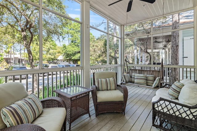 sunroom / solarium featuring ceiling fan