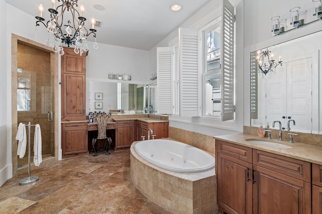 bathroom with vanity, shower with separate bathtub, and an inviting chandelier