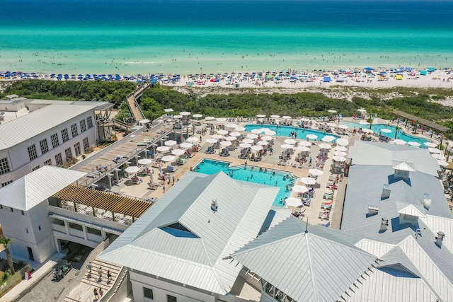 birds eye view of property featuring a water view and a view of the beach