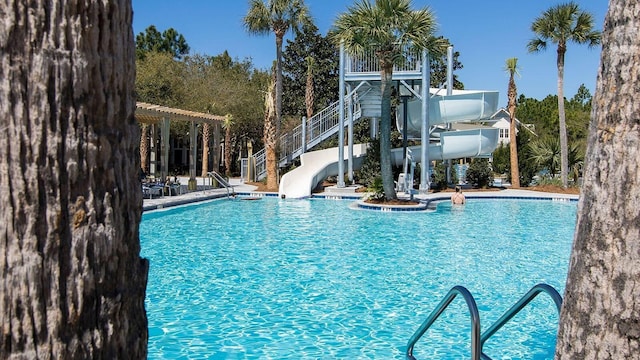 view of swimming pool featuring a water slide