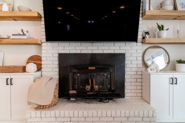 details with a brick fireplace