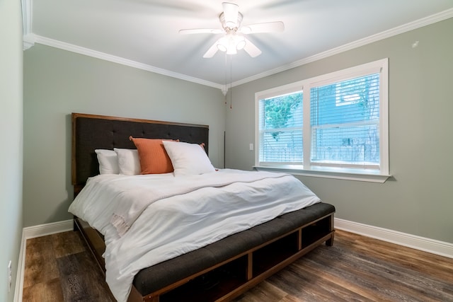 bedroom featuring ornamental molding, dark hardwood / wood-style floors, and ceiling fan