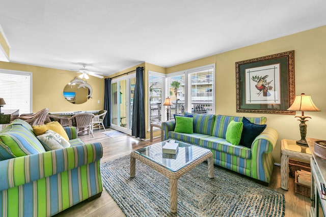 living room with ceiling fan and light hardwood / wood-style floors