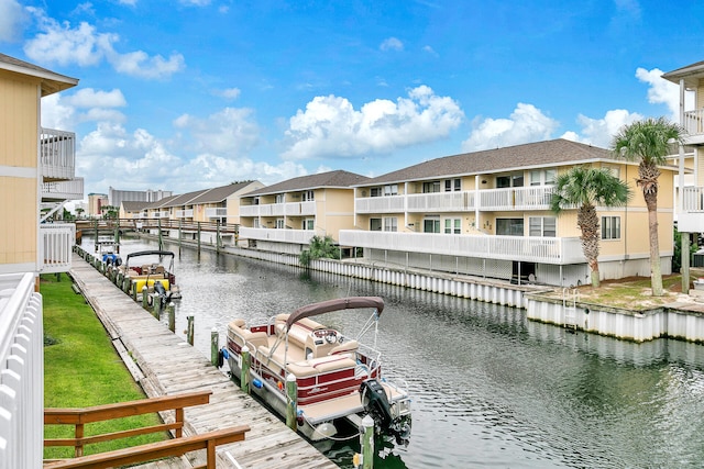 view of dock featuring a balcony and a water view