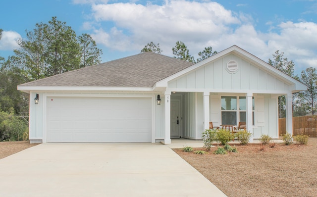 ranch-style house with a garage and covered porch