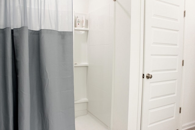 bathroom featuring a shower stall