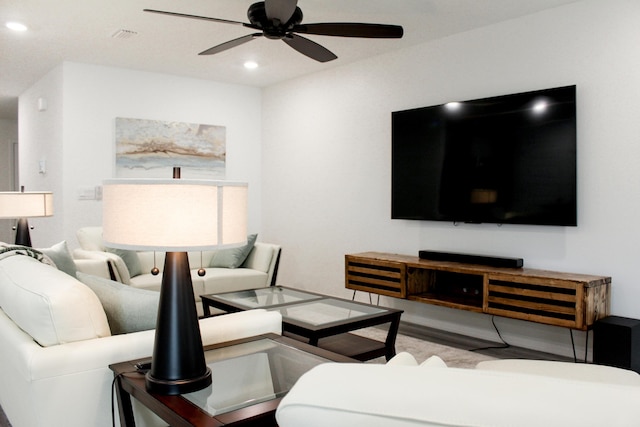 living room featuring ceiling fan and recessed lighting