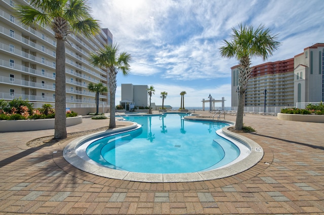 view of swimming pool featuring a patio area