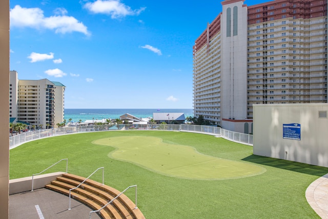 surrounding community featuring a water view