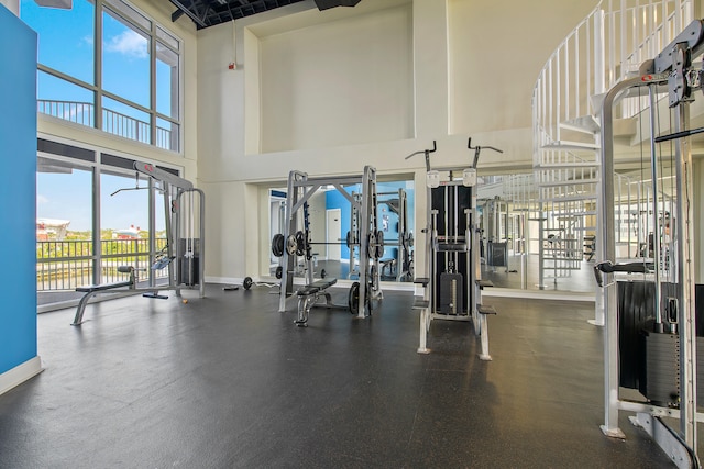 workout area featuring a high ceiling