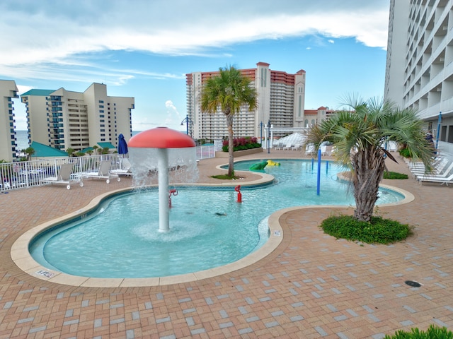 view of swimming pool featuring a patio area and pool water feature