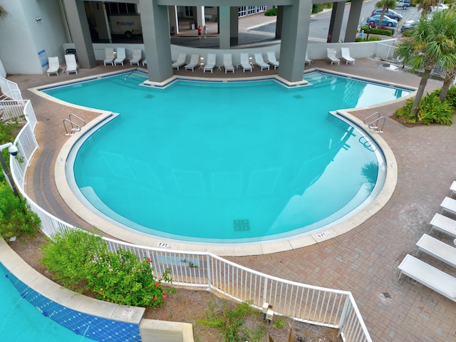 view of swimming pool with a patio area