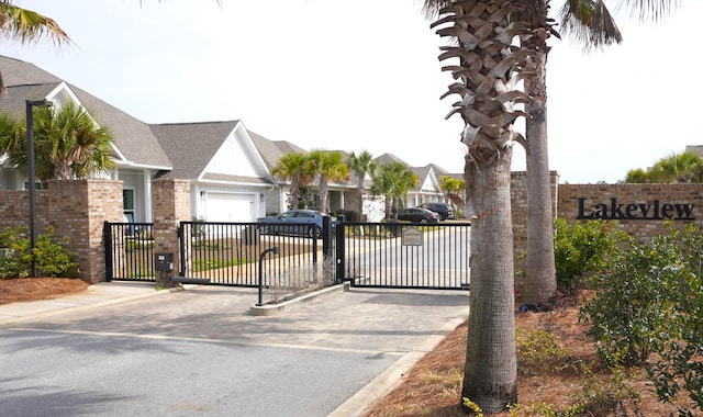 view of gate with a garage